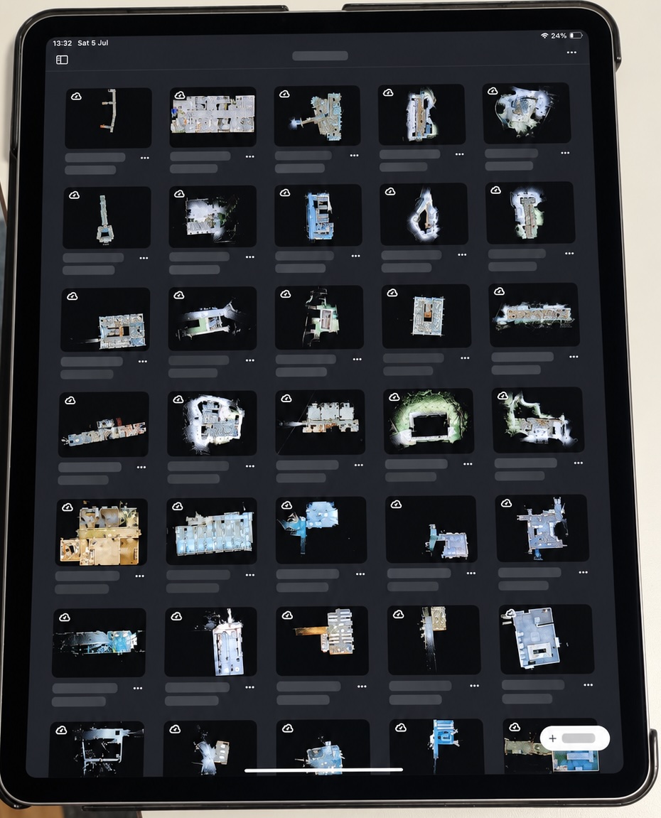 Tablet showing a library of captured building scans and registered spatial projects.